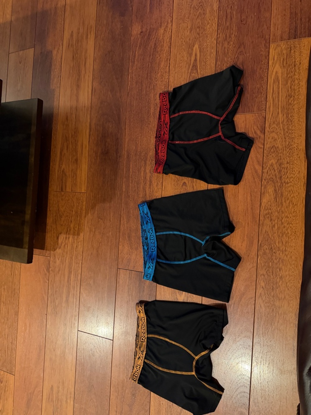 Reebok Black Boxer Briefs Set with Red, Blue, and Gold Accents